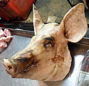 'A Pigshead for Sale on Ranong's Fresh Market' by Asienreisender